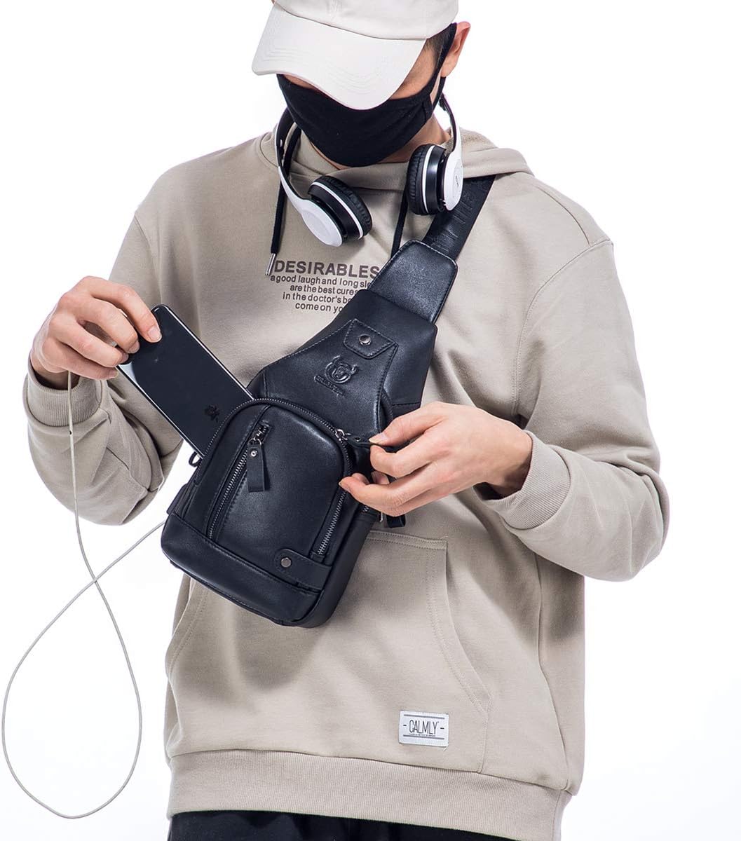 Man wearing the black leather sling bag as a chest bag while reaching into the front pocket